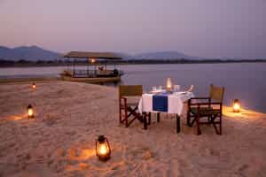 Enjoy a sundowner boat cruise on the Zambezi River