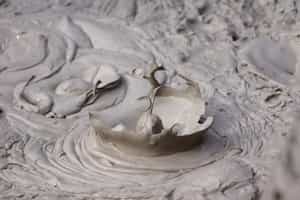 Take a mud bath and swim at the hot springs