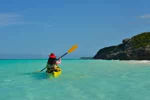 Kayak across pretty lagoons and shaded rivers